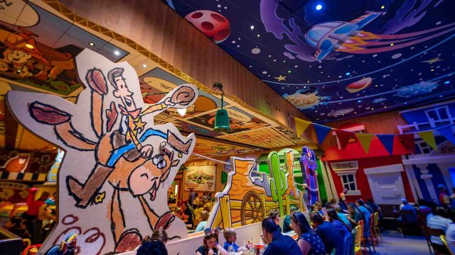 Roundup Rodeo BBQ Interior - cardboard cutout of children's drawing of Woody and Bullseye in the main dining room.